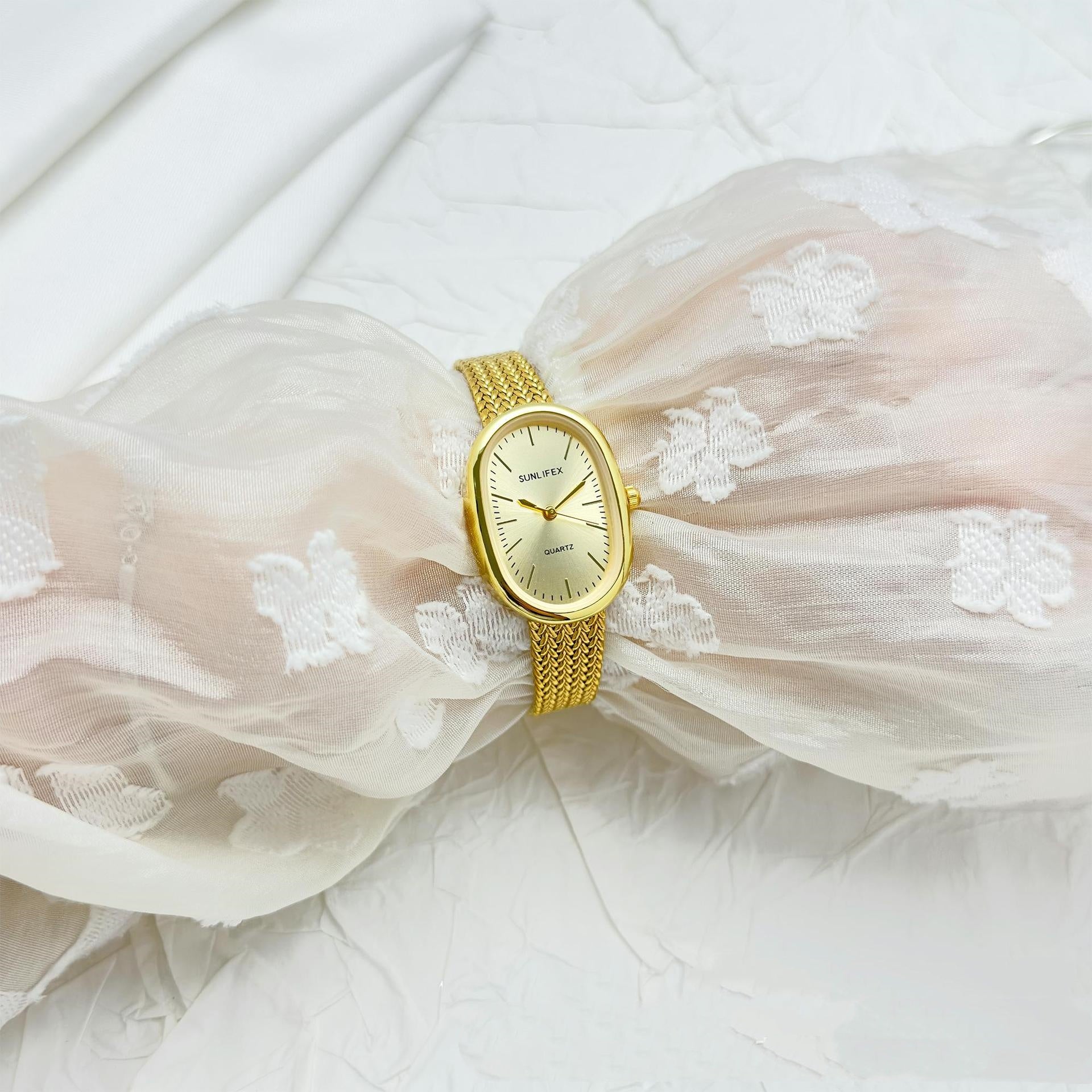 Gold Oval Dial Watch